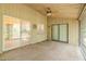 Relaxing screened porch featuring ceiling fan and access to kitchen through sliding door at 1228 Rainbrook Cir, Valrico, FL 33596