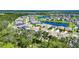Community aerial view features lake and homes near green space, pinpoints property at 12957 Satin Lily Dr, Riverview, FL 33579