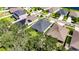 Aerial view of the property shows its location surrounded by lush greenery in a neighborhood at 12957 Satin Lily Dr, Riverview, FL 33579