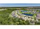 Aerial view of a community with a lake and houses, highlighting the property's location at 12957 Satin Lily Dr, Riverview, FL 33579