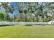 Expansive backyard features green lawn and privacy fence at 12957 Satin Lily Dr, Riverview, FL 33579