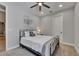Cozy bedroom with ceiling fan, recessed lights, and a decorative floral print above the bed at 12957 Satin Lily Dr, Riverview, FL 33579
