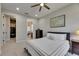 Bedroom features ceiling fan, carpet, and adjoins bathroom and closet at 12957 Satin Lily Dr, Riverview, FL 33579