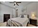 Bright bedroom with ceiling fan, recessed lights, and a neutral color scheme at 12957 Satin Lily Dr, Riverview, FL 33579