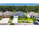 Well-maintained homes featuring manicured lawns and landscaping in a suburban neighborhood at 12957 Satin Lily Dr, Riverview, FL 33579