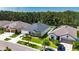 Exterior of a beautifully landscaped single-Gathering home with a well-maintained front yard at 12957 Satin Lily Dr, Riverview, FL 33579