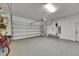 Spacious garage with overhead door, smooth floor, and room for vehicles at 12957 Satin Lily Dr, Riverview, FL 33579