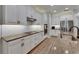Bright kitchen with white cabinets, granite countertops, stainless steel appliances, and a stylish backsplash at 12957 Satin Lily Dr, Riverview, FL 33579