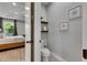 Powder room with shelving and decorative art at 12957 Satin Lily Dr, Riverview, FL 33579