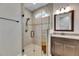 Neutral colored tile inside glass shower at 12957 Satin Lily Dr, Riverview, FL 33579