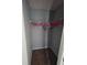 Walk-in closet with hanging racks that provide ample storage for clothes and accessories at 13157 Kings Crossing Dr, Gibsonton, FL 33534