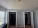 Bedroom view with multiple walk-in closets featuring custom shelving and storage at 13157 Kings Crossing Dr, Gibsonton, FL 33534