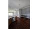Open dining area with hardwood floors, adjacent to the kitchen and living spaces at 13157 Kings Crossing Dr, Gibsonton, FL 33534