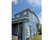 Two-story home's exterior boasts a textured facade, updated windows and a covered front entry at 13157 Kings Crossing Dr, Gibsonton, FL 33534