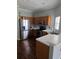 Well-equipped kitchen with stainless steel appliances, wood cabinets, and laminate countertops at 13157 Kings Crossing Dr, Gibsonton, FL 33534