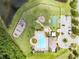 Top-down aerial view of community amenities: pool, playground, basketball court, parking, and picnic area at 13803 Chalk Hill Pl, Riverview, FL 33579