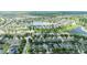 Aerial view of the community showcasing residential homes, lush landscaping, ponds, and well-maintained streets at 13803 Chalk Hill Pl, Riverview, FL 33579