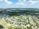 Aerial view of a residential neighborhood with several ponds and green spaces at 13803 Chalk Hill Pl, Riverview, FL 33579