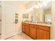 Bathroom featuring double vanity, granite countertops, and good lighting at 13803 Chalk Hill Pl, Riverview, FL 33579