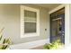 Bright entryway featuring a stylish glass paneled front door and neutral paint at 13803 Chalk Hill Pl, Riverview, FL 33579
