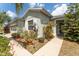 Attractive home exterior with a well kept lawn and decorative features at 13803 Chalk Hill Pl, Riverview, FL 33579