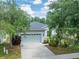Charming single-story home featuring a two-car garage, well-maintained landscaping, and a welcoming entrance at 13803 Chalk Hill Pl, Riverview, FL 33579