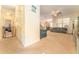 Hallway view showing an open floor plan with access to living area with neutral color palate at 13803 Chalk Hill Pl, Riverview, FL 33579