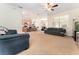 Open-concept living area with a view of the kitchen and dining space, neutral palette at 13803 Chalk Hill Pl, Riverview, FL 33579