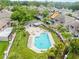 Aerial view showcasing a beautiful pool, lounge furniture, landscaping and backyard area at 14134 Trouville Dr, Tampa, FL 33624
