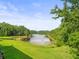 Beautiful view of a lake and lush, green backyard at 14134 Trouville Dr, Tampa, FL 33624