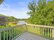 Balcony view of a lush, green landscaped yard and tranquil lake at 14134 Trouville Dr, Tampa, FL 33624