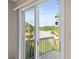 Balcony view of a lush, green landscaped yard and tranquil lake at 14134 Trouville Dr, Tampa, FL 33624