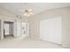 Neutral bedroom featuring a ceiling fan and closet with bi-fold doors at 14134 Trouville Dr, Tampa, FL 33624