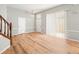 Bright entryway featuring a staircase, hardwood floors, and painted walls at 14134 Trouville Dr, Tampa, FL 33624