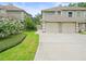 Charming two-story home with well-maintained landscaping and a two-car garage at 14134 Trouville Dr, Tampa, FL 33624
