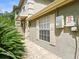 Two-story home featuring a brick walkway and well-maintained landscaping at 14134 Trouville Dr, Tampa, FL 33624