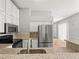 Kitchen features stainless steel appliances, granite countertops, and modern cabinets at 14134 Trouville Dr, Tampa, FL 33624