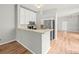 Kitchen featuring white cabinets, stainless steel appliances, and granite countertops at 14134 Trouville Dr, Tampa, FL 33624