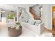 Bright living room with staircase, wood floors, and stylish modern decor at 14134 Trouville Dr, Tampa, FL 33624