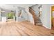 Bright living room with staircase, wood floors, and stylish modern decor at 14134 Trouville Dr, Tampa, FL 33624
