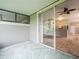 View of the patio with a sliding glass door leading into a spacious interior with stainless steel appliances at 14134 Trouville Dr, Tampa, FL 33624