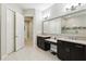 Bathroom featuring modern vanities, tub, and a glass enclosed shower at 14715 Fishhawk Preserve Dr, Lithia, FL 33547