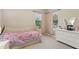Bright bedroom featuring a daybed, two windows, and a dresser featuring modern decor at 14715 Fishhawk Preserve Dr, Lithia, FL 33547