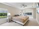Spacious bedroom with a trey ceiling, and access to an exercise area at 14715 Fishhawk Preserve Dr, Lithia, FL 33547