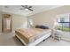 Spacious bedroom with a trey ceiling, and carpeted floors at 14715 Fishhawk Preserve Dr, Lithia, FL 33547