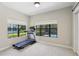 Exercise room with a view of the pool at 14715 Fishhawk Preserve Dr, Lithia, FL 33547