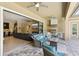 Spacious outdoor living area with an outdoor kitchen and views of the pool and backyard at 14715 Fishhawk Preserve Dr, Lithia, FL 33547