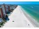 Panoramic aerial view of sandy beach, the Gulf of Mexico, and complex with a pool at 17920 Gulf Blvd # 1806, Redington Shores, FL 33708