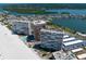 Aerial view showing the condo buildings near the beach and surrounding neighborhood with canals and waterways at 17920 Gulf Blvd # 1806, Redington Shores, FL 33708