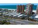 Aerial view of a street and parking garage near high rise buildings, a beach, and ocean at 17920 Gulf Blvd # 1806, Redington Shores, FL 33708